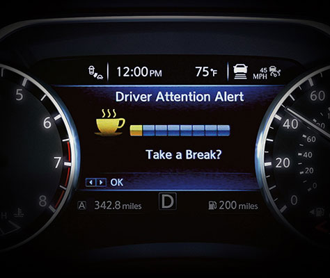 An advisory alert on a car dashboard